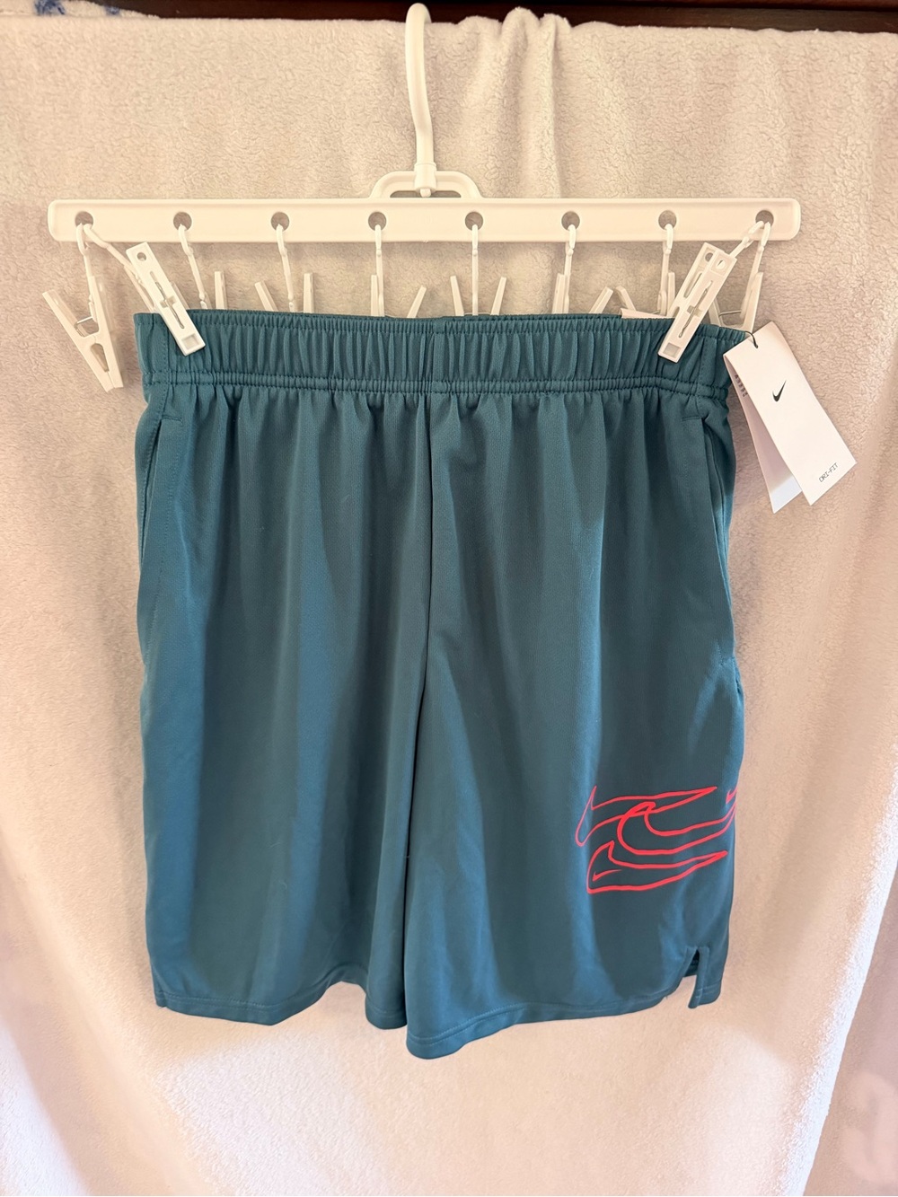 Nike Youth Teal Athletic Shorts with orange Logo Accent